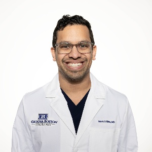 headshot of make doctor with glasses named Dr. Mark Silva