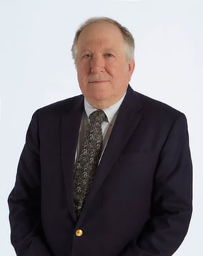 professional headshot for Dr. Bamberger, a white male with balding head and a suit and tie