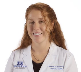 headshot for physician assistant Shonah Anderson, a young woman with long curly red hair