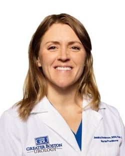 headshot from the shoulders on up of white woman with shoulder-length blonde hair. She's wearing a lab coat that says Greater Boston Urology and her name Jessica Anderson