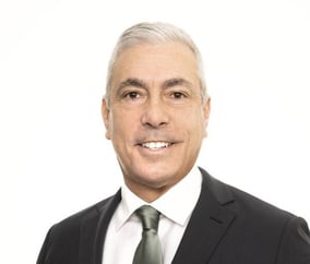 headshot of a Dr. Ronald Ebb, an older man with silver hair and brown eyes