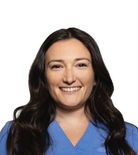 headshot from shoulders up of white woman with long brown hair